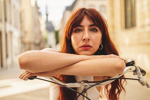Portrait of a woman riding a bicycle in a city
