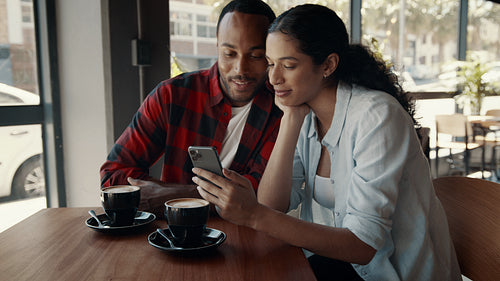 Happy couple enjoying dating in a cafe