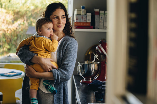 Caring mom with baby at home