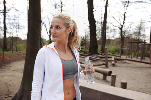 Young woman after working out at a park