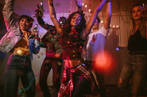 Friends dancing at a house party