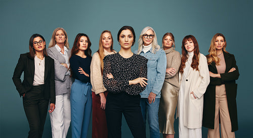 Young woman standing with a group of strong independent women