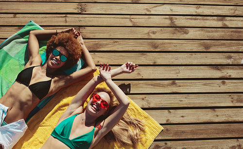 Women relaxing on beach holiday