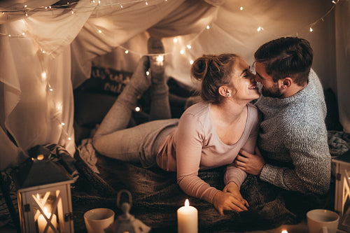 Couple on bed together in romantic mood