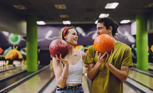 Dating couple enjoying bowling together