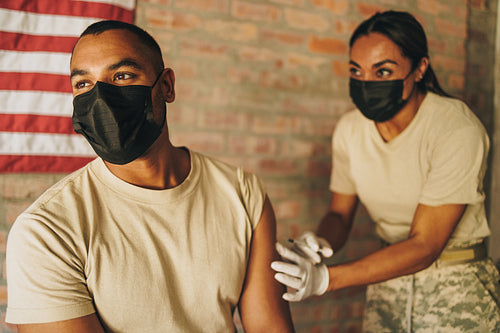 Soldier getting vaccinated against covd-19 in the army hospital