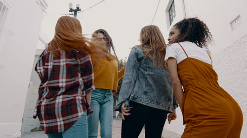 Friends having fun and dancing outdoors