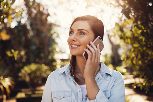 Female talking on cell phone outdoors