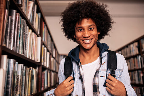 College student standing in library