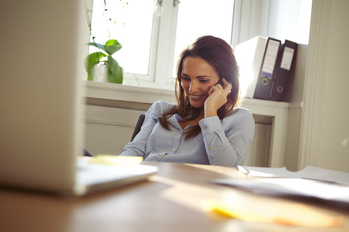 Beautiful young woman talking on mobile phone
