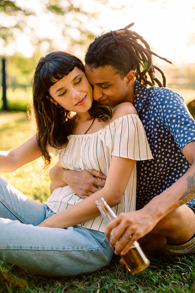 Adorable couple being romantic in a park