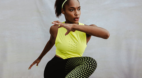 African woman with fit body doing workout