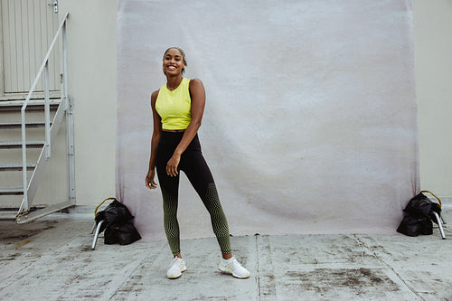 African sportswoman standing on rooftop