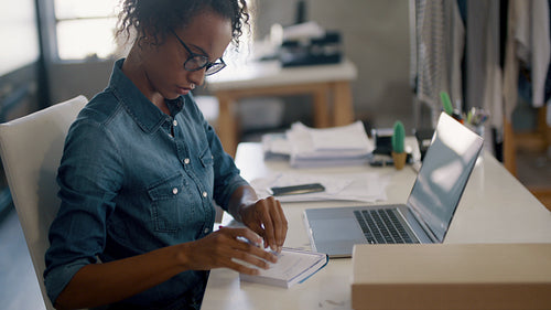 Online store owner working at her desk