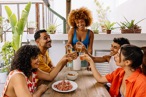 Group of friends sharing drinks on a summer day