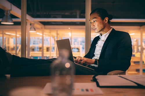 Entrepreneur working on laptop in office