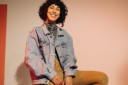Fashionable young woman smiling at the camera