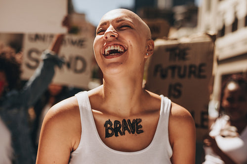 Brave woman with group of protesters in background