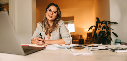 Designer working on a new project in her home office