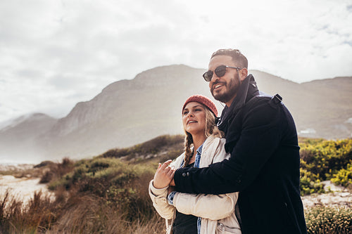 Loving couple looking at a view