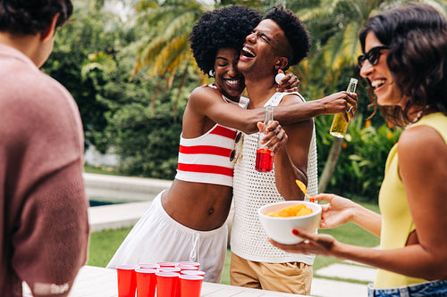 Drinking game with friends at pool party