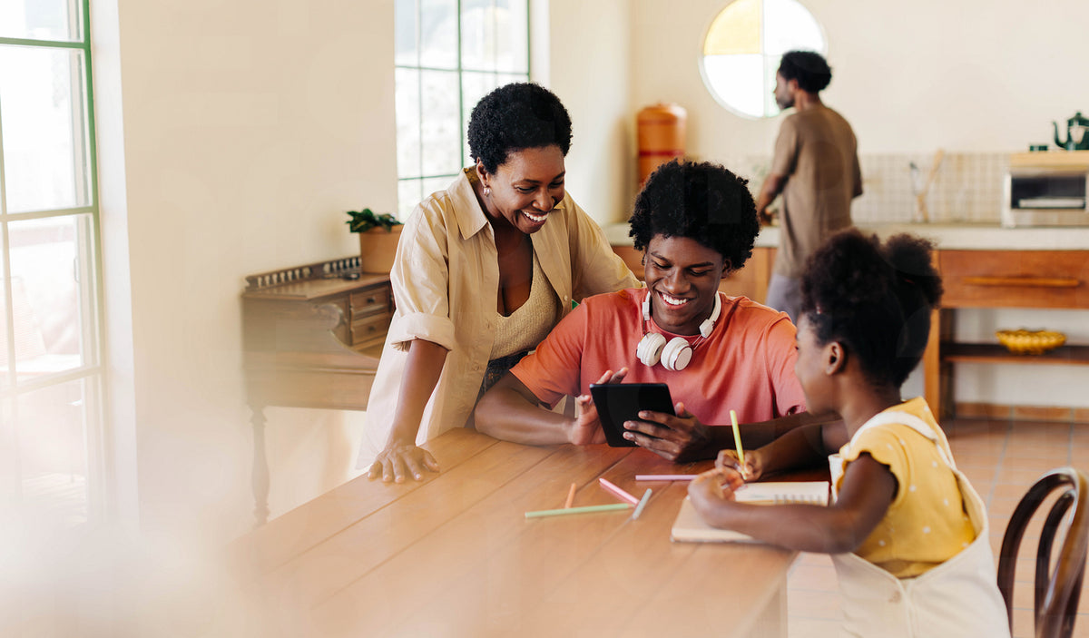 Happy family learning together at home using technology – Jacob Lund ...