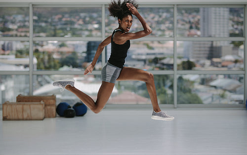 Sporty woman doing intense exercises