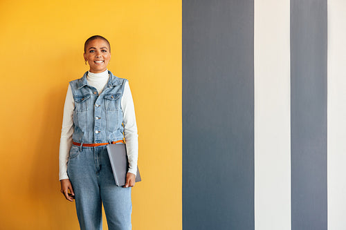 Modern businesswoman smiling at the camera happily