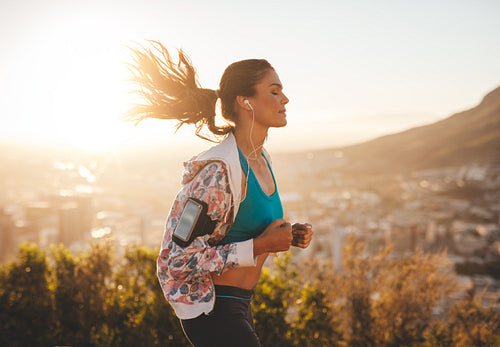 Beautiful young woman out for a run