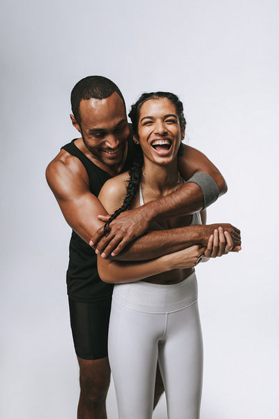 Portrait of fit couple having fun at workout