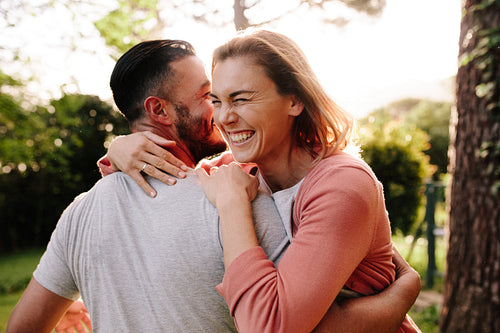 Happy couple having fun outdoors in park