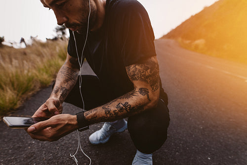 Man taking a break after jogging