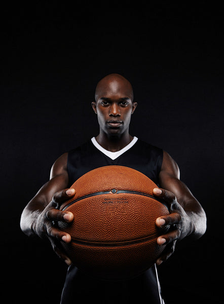 Professional african basketball player with a ball