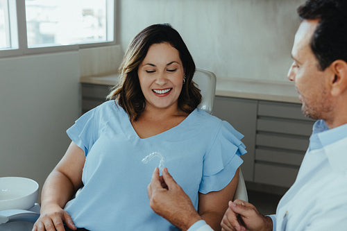 Discussing dental aligner options with patient in clinic