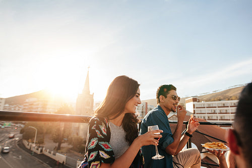 Group of friends partying on rooftop
