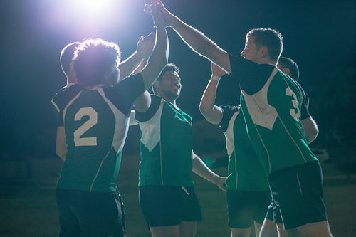 Rugby players celebrating championship win