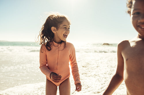 Happy young girl laughing happily at the beach