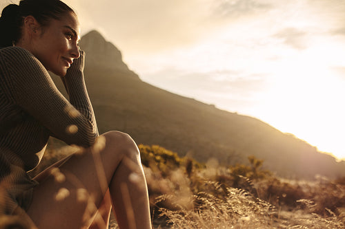Female tourist taking a rest after a country walk