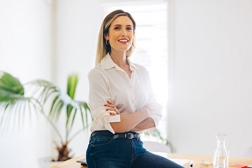 Manager smiling at the camera in a modern office