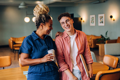 Young man and woman enjoying a candid moment in an indoor setting