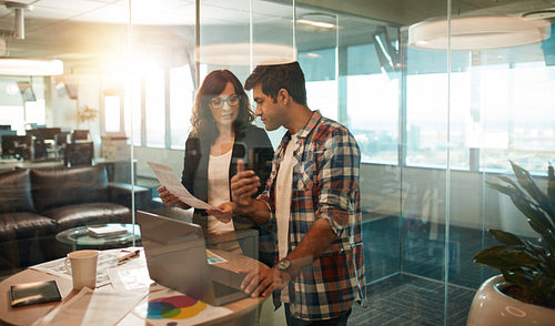 Designers working together in creative workplace