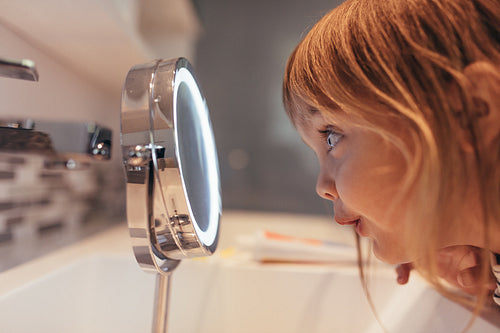 Girl looking in a mirror