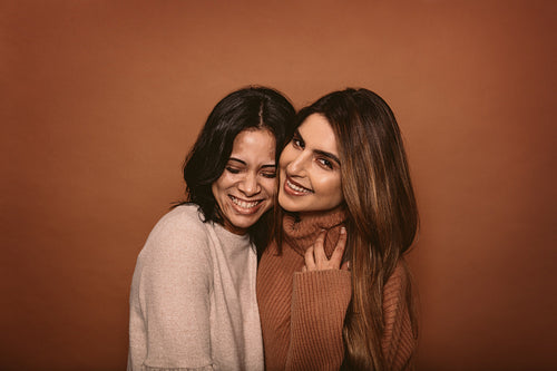 Happy female friends smiling together