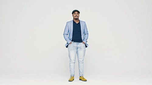 Confident man in jacket and cap