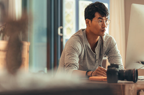 Photographer doing post production on pictures