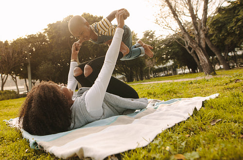 Mother playing with his son at park