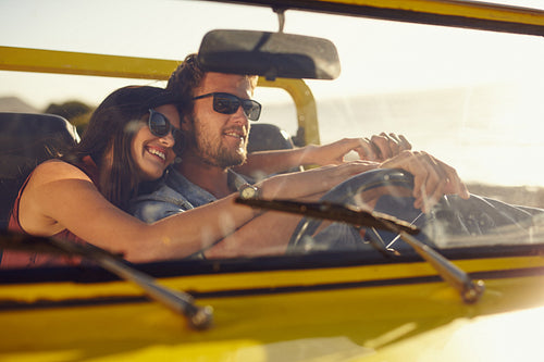 Romantic young couple going on a long drive