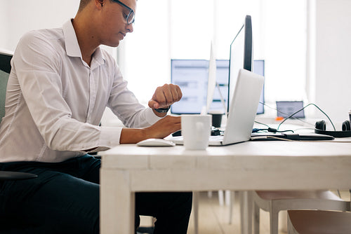 Application developer working on computer in office