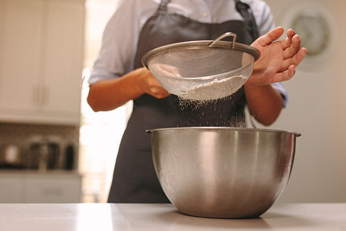 Woman baking in home kitchen