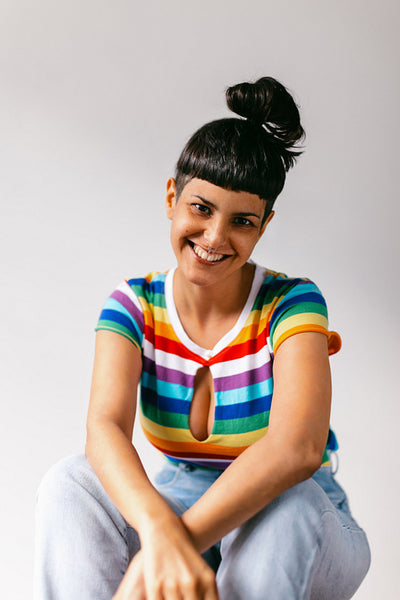 Gay woman celebrating pride in a studio